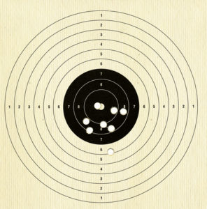 gun range target with 8 bullet holes