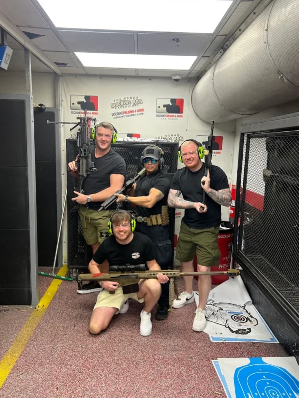 Friends posing together inside the indoor shooting range